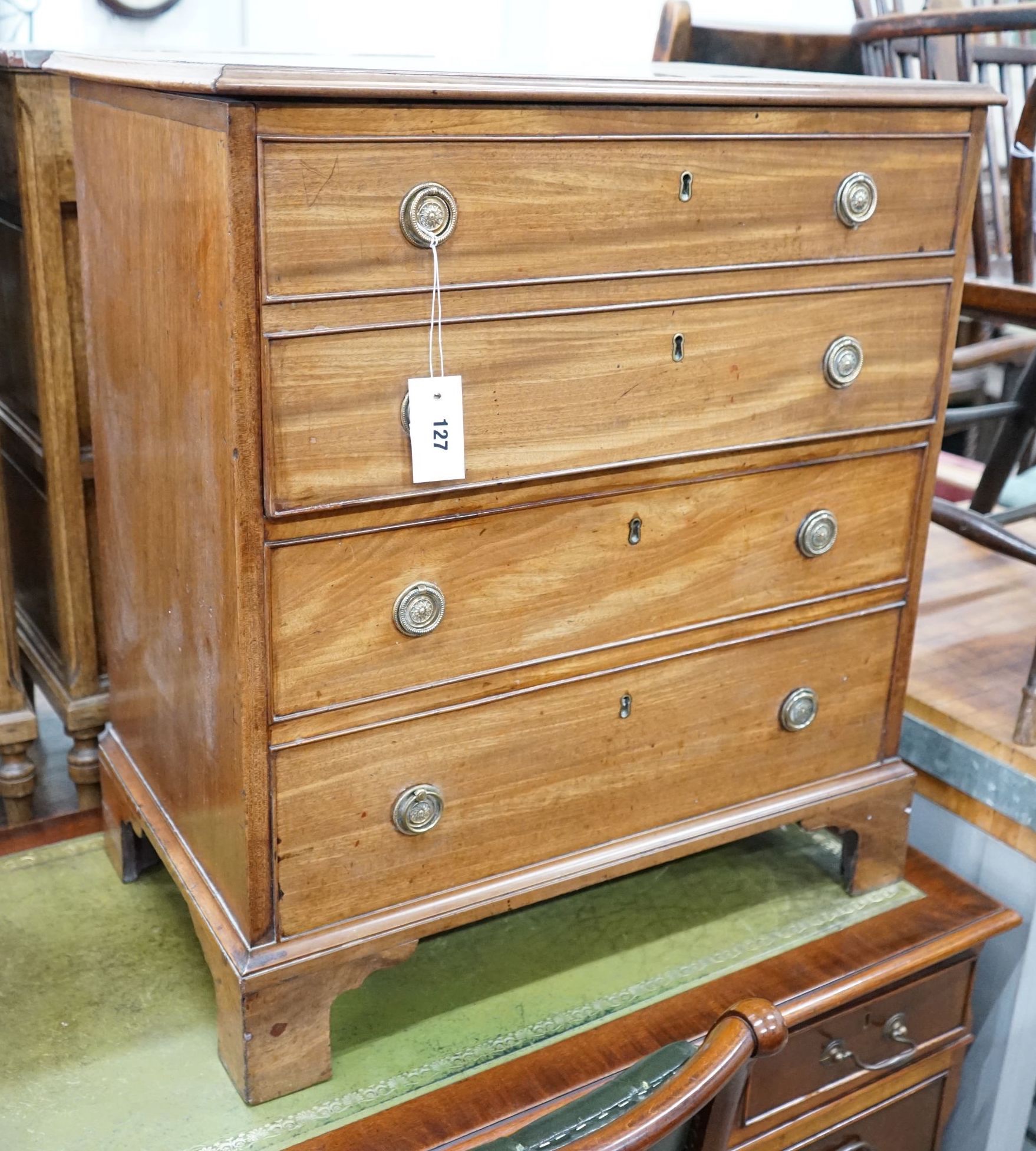 A George III mahogany hinged top commode with dummy drawer front and brass handles, width 66cm, depth 42cm, height 74cm